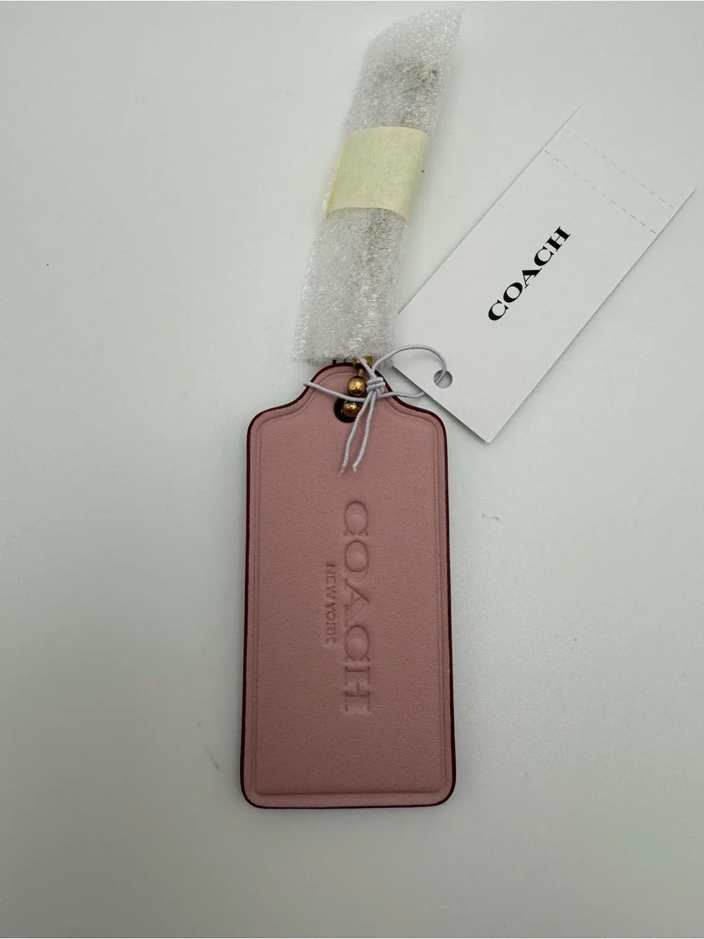 Coach hangtag charm